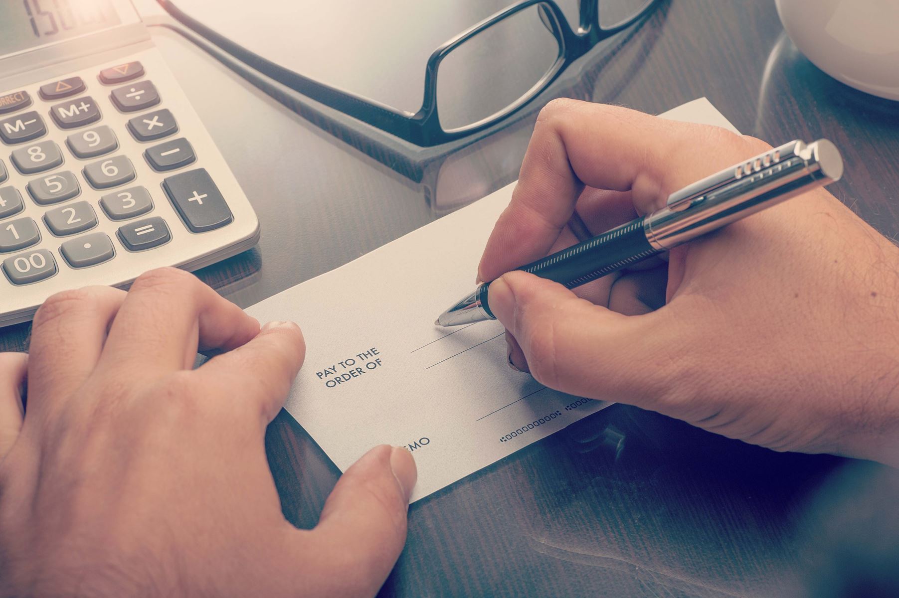 Man writing out a check