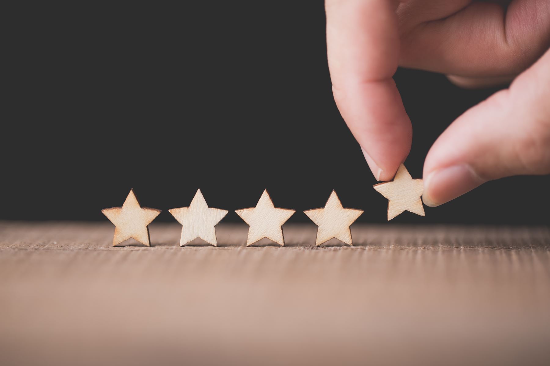 5 wooden stars placed on a table